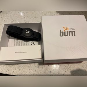 Orange theory heart rate monitor with extra band and instructions inside